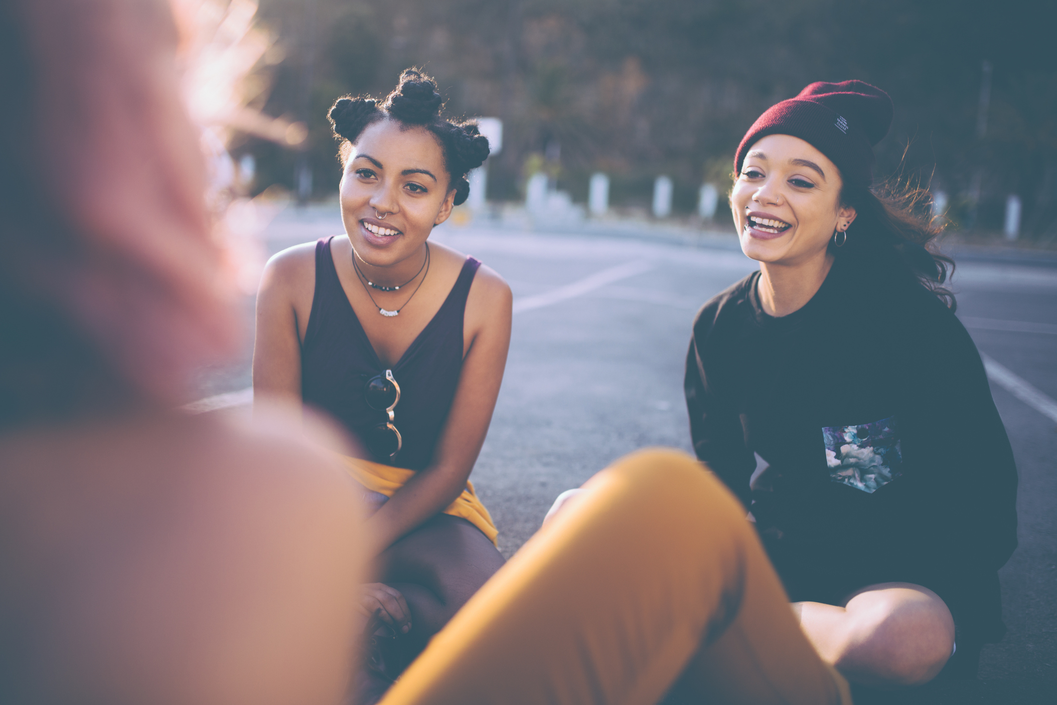 Mixed race group of teen grunge girls talking outside